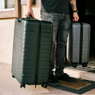 cases_600x600 A man holding two suitcases
